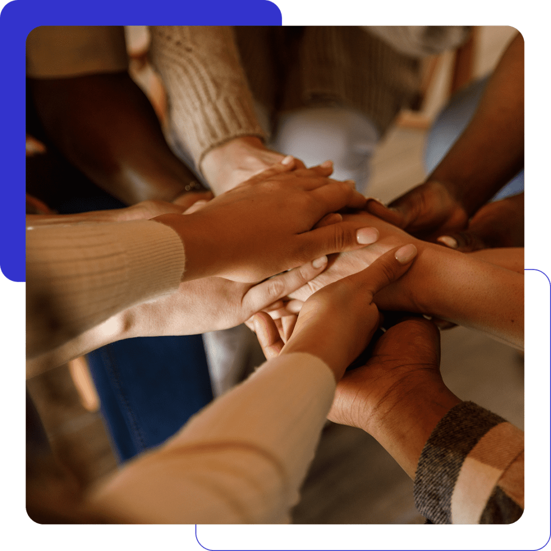 Hands united in teamwork gesture