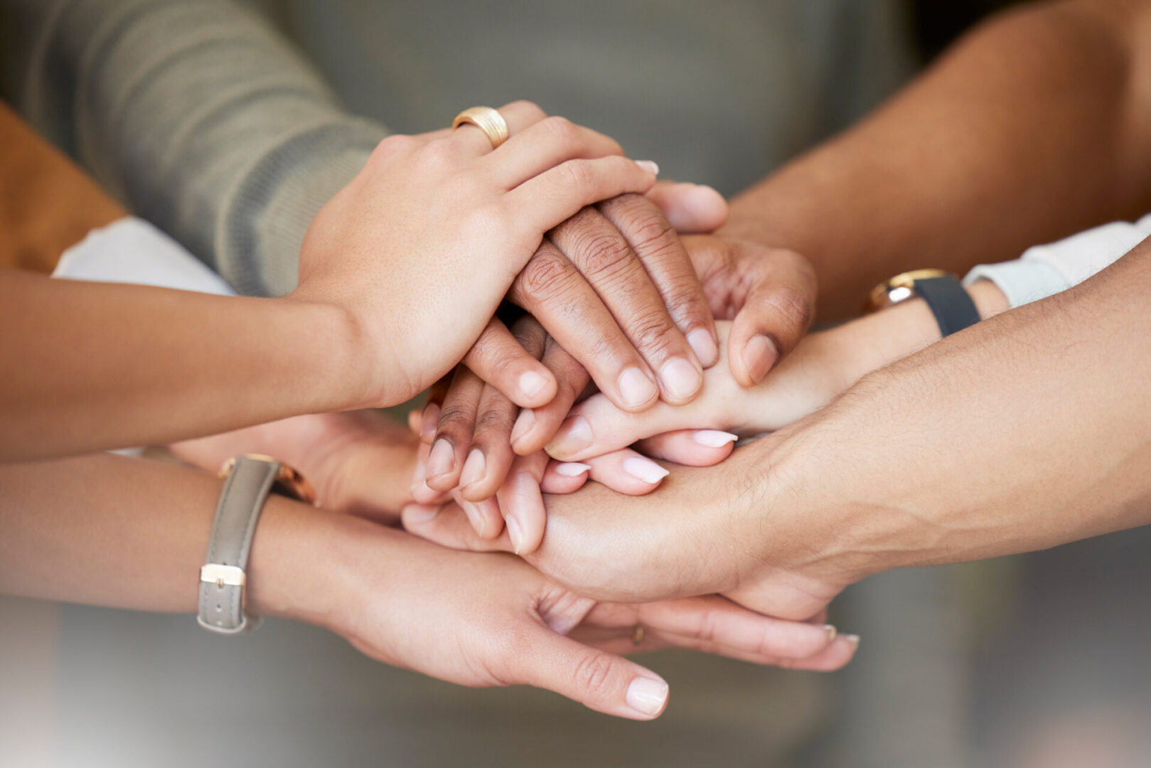 Hands stacked in unity